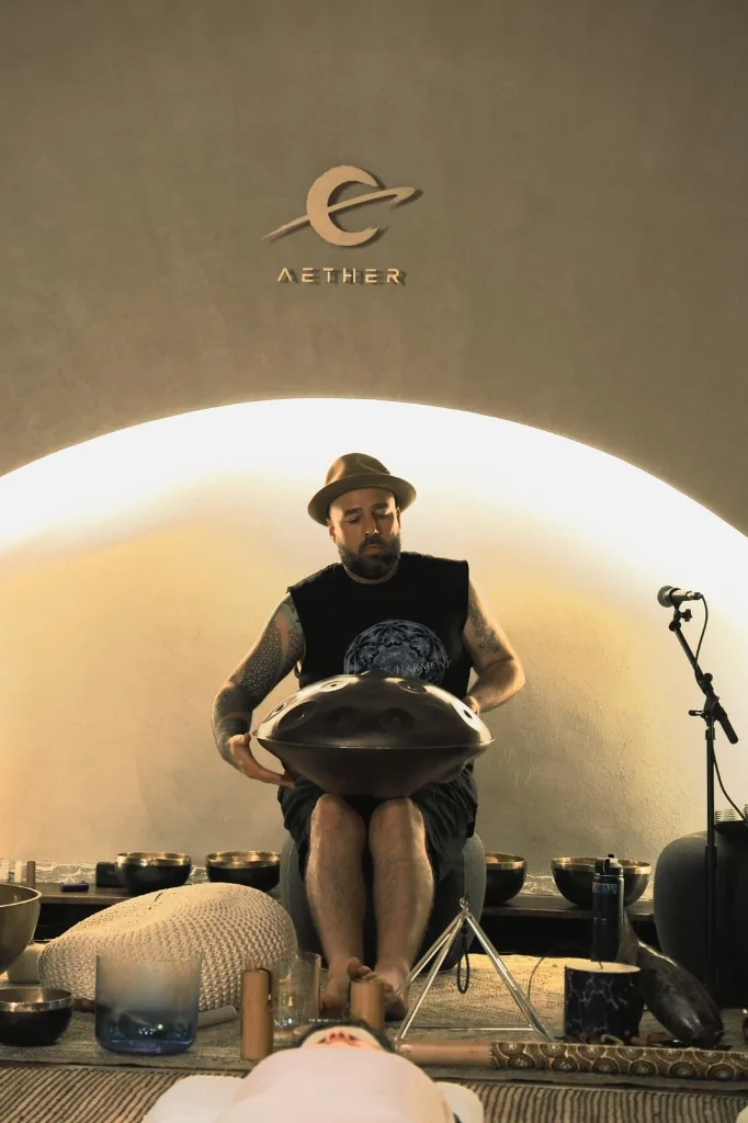 Dan Byrne playing a handpan during a sound healing session